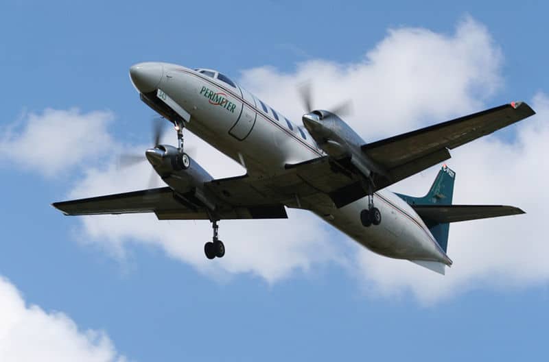 location jet privé: METRO III en vol, ciel partiellement nuageux.